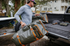 Green Fishpond Stormshadow Large Rolling Duffel designed for anglers and travelers with extensive storage