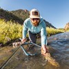 Angler using the Orvis Wide-Mouth Hand Net on the river