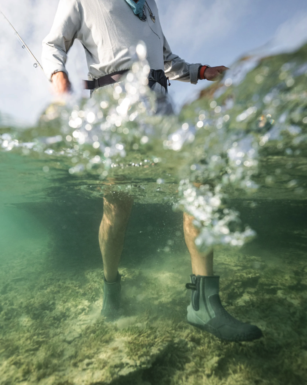 Simms ZipIt Flats Booties worn during a saltwater fly fishing expedition, demonstrating their rugged and functional design