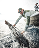 Angler landing sailfish next to a boat