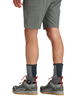 Rear view of model wearing Simms Neoprene Wading Socks with boots.